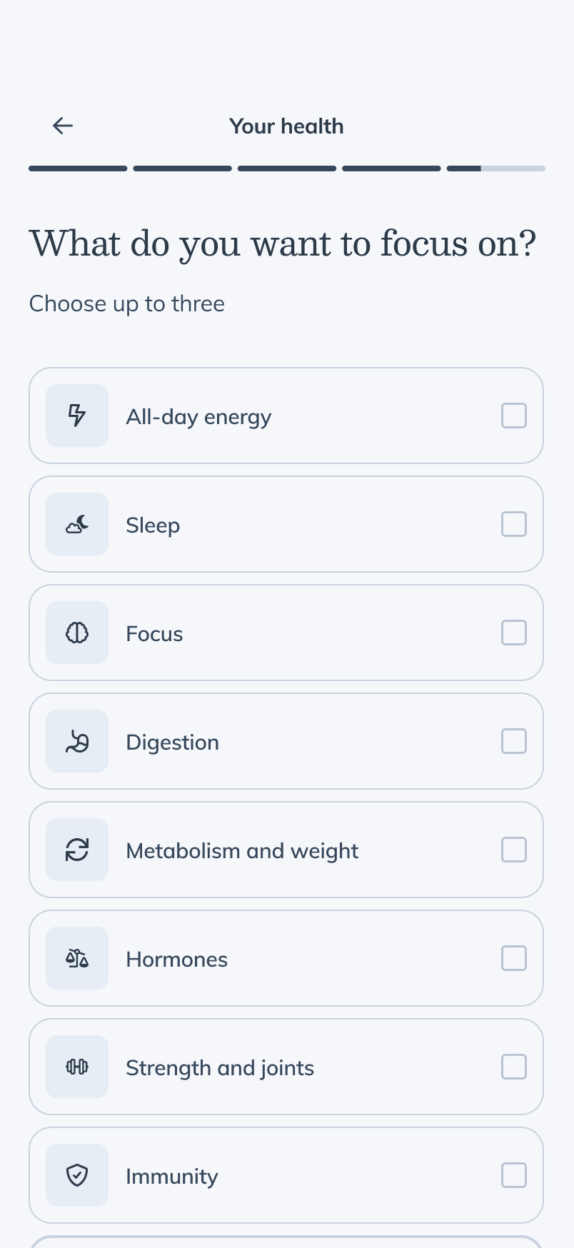 Health goals screen — 'What do you want to focus on?', choose up to three from a list of focus areas, with no skip button